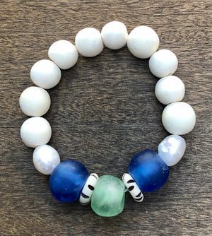 blue african trade bead, white wood, and freshwater baroque pearl bracelet